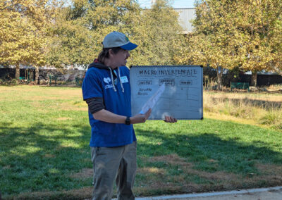 A docent from the park describes elements commonly found in river water.