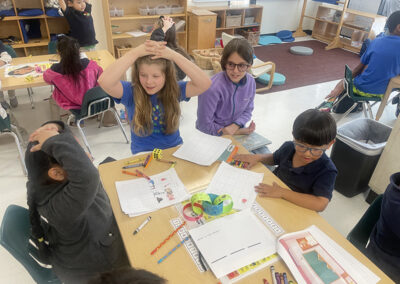 5th graders and their buddies at Para Los Ninos play a game of "Simon Says."