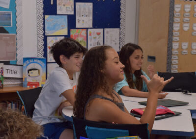 Sixth graders are eager to learn new signs.