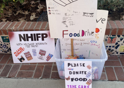 The handmade signs made by 2nd graders to advertise the food drive.