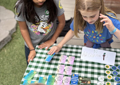 4th graders sell handmade magnets with environmental messages at the "shade sale."
