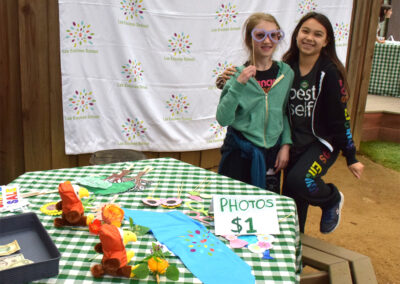 4th graders operate a photo booth at the "shade sale."