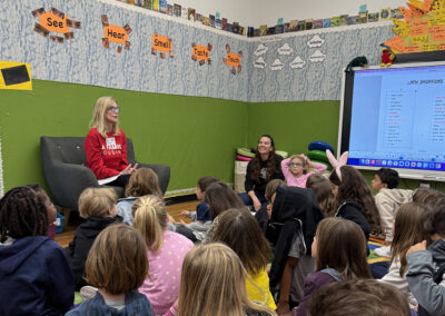 A rep from LA Family Housing describes their greatest "needs" to the kindergarteners in preparation for their shopping trip.